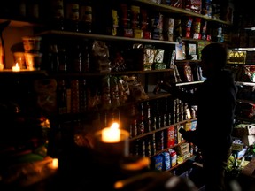 A vendor waits for customers during a national blackout, in Buenos Aires, Argentina June 16, 2019.