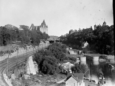 Rideau Canal locks and Grand Trunk Railway tracks behind Chateau Laurier Hotel, likely early 1920s.