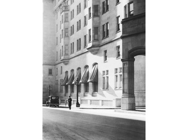 "Morning Light," a photograph by Clifford M. Johnston, 1929. Johnston was famous for his soft, artistic pictures, this one of a man standing outside one of the east entrances the Chateau Laurier Hotel strikes a European feeling.