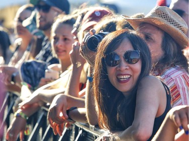 Fans watch the band "James" at Bluesfest in Ottawa on Sunday.