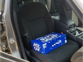 A Wellington North man was caught using a 30-can case of beer as a booster seat for his young child in Atwood early Tuesday morning.