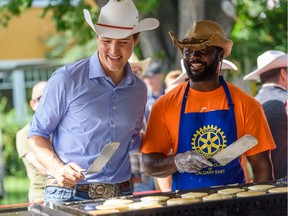 Prime Minister Justin Trudeau makes pancakes at a community Stampede Breakfast at Sunalta in Calgary on July 13. Can he still use the 'sunny ways' mantra to good effect in this fall's election? Maybe.