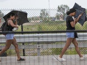 Volunteers and workers head to the Canadian War Museum as Bluesfest was delayed once again for a severe thunderstorm warning in Ottawa on day 7 of RBC Bluesfest.