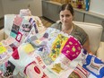 Megan LaVictoire with a quilt made from her daughter Lauren's clothes. Lauren died in November 2016, a month short of her fourth brithday.