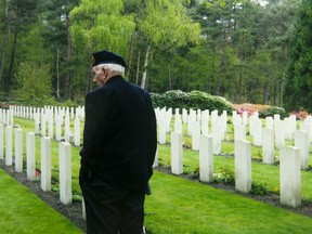 D-Day vet Bud Hannam in a war cemetery in Normandy in 2010.