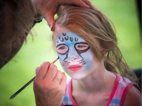 Maève Serviss who will soon be turning nine, gets her face painted as a funky leopard at a 'Very Merry Unbirthday Party' at Larkin Park Saturday celebrating children who struggle with friendships and don't always get invited to birthday parties. Saturday, July 27, 2019.
