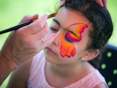 Six-year-old Aleya Aly gets her face painted Saturday afternoon.   Ashley Fraser/Postmedia