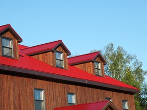 Metal roofing like this can be applied directly over old asphalt shingles as long as the roof deck is free of sagging and waviness.