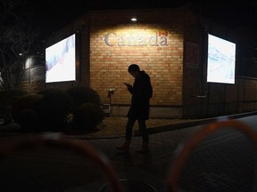 A man walks past the Canadian embassy.