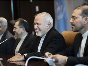 Mohammad Javad Zarif (2 from R), the foreign minister of Iran, smiles as he arrives for a meeting with UN Secretary-General Antonio Guterres at United Nations headquarters, July 18, 2019 in New York City. On Thursday afternoon, U.S. President Donald Trump said the U.S. Navy shot down an Iranian drone in the Strait of Hormuz.