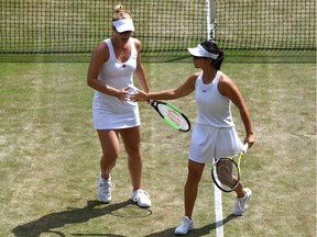 Gabriela Dabrowski of Ottawa and Yifan Xu of China celebrate in their women's doubles semi-final victory against Barbora Krejcikova of Czech Republic and Katerina Siniakova of The Czech Republic at the All England Lawn Tennis and Croquet Club on Friday, July 12, 2019 in London, England.