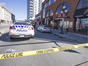 Police cordon off the crime scene after a deadly shooting in the ByWard Market July 1.