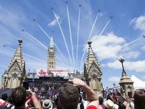 FILE PHOTO: The Snowbirds fly over Parliament Hill as July 2019 Canada Day activities were in full swing throughout the downtown core.