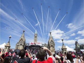 The Snowbirds fly over Parliament Hill as Canada Day activities are in full swing through out the downtown core.  Photo by Wayne Cuddington/ Postmedia