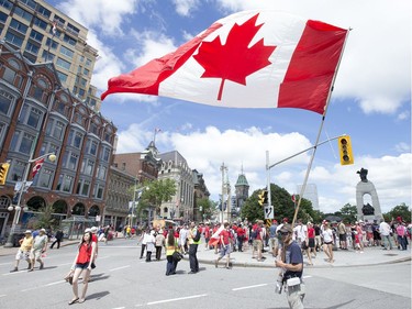 Marc Henrie has been bringing his 6'x12' Canadian flag, that originally flew on the Peace Tower, downtown for the last thirty years he says to celebrate Canada Day with all his fellow Canadians.