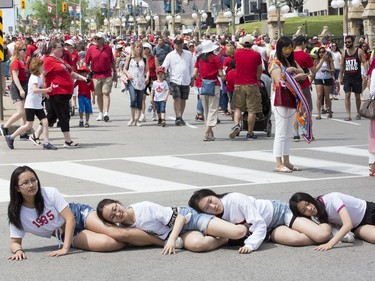 Girls pose for a group photo as Canada Day activities are in full swing through out the downtown core.