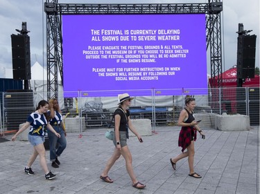 Music fans seek the safety of the Canadian War Museum while the festival waits out the severe weather warning as the second day of RBC Bluesfest gets going on Friday evening.