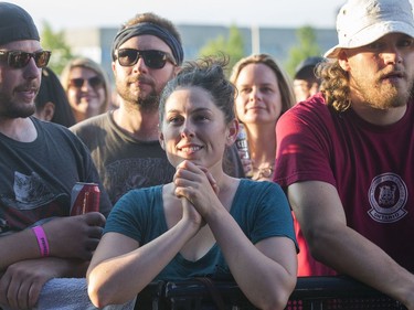 Fans watch as Jason Isbell and The 400 Unit with his wife  Amanda Shires on fiddle take to the city stage after the severe weather warning passed as the second day of RBC Bluesfest gets going on Friday evening.

Photo by Wayne Cuddington / Postmedia