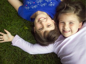 Hillary McKibbin (right) and her big sister Alyssa hang out together in their backyard.