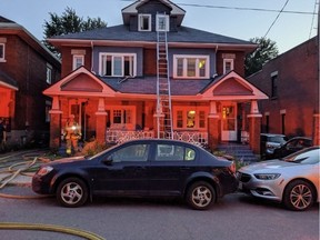 Firefighters on the scene of fire at 168 Goulburn Ave. Heavy smoke and open flame visible from the rear of a 2-1/2 storey home. Twitter photo by Scott Stilborn.