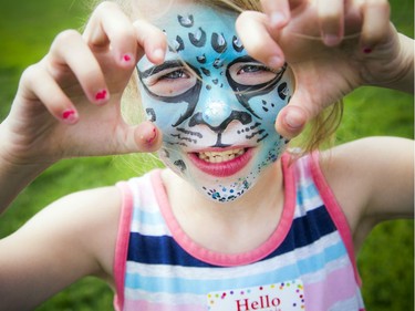 Maève Serviss shows off her funky leopard face paint.  Ashley Fraser/Postmedia