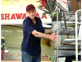 Waldo's Shawarma owner Huseyin Uran removes the last of his store's belongings from the Lincoln Fields Shopping Centre Wednesday.