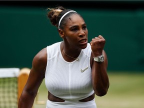 US player Serena Williams celebrates winning a point against US player Alison Riske during their women's singles quarter-final match on day eight of the 2019 Wimbledon Championships