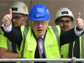 Conservative Party leadership candidate Boris Johnson gestures during a visit to construction work for the expansion of Terminal Two at Manchester Airport on July 9.