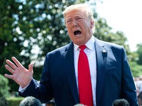 (FILES) In this file photo taken on July 5, 2019 US President Donald Trump speaks to the media as he walks to Marine One prior to departing from the South Lawn of the White House in Washington, DC. - President Donald Trump warned July 10, 2019 that sanctions against Iran would soon be "increased substantially" after Tehran said it had exceeded a limit on enriched uranium reserves under a 2015 nuclear deal abandoned by Washington.