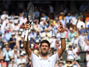 Serbia's Novak Djokovic celebrates beating Spain's Roberto Bautista Agut during their men's singles semi-final match on day 11 of the 2019 Wimbledon Championships at The All England Lawn Tennis Club in Wimbledon, southwest London, on July 12, 2019.