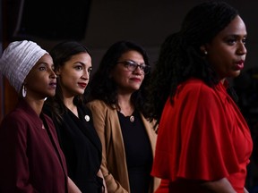 TOPSHOT - US Representatives Ayanna Pressley (D-MA) speaks as, Ilhan Abdullahi Omar (D-MN)(L), Rashida Tlaib (D-MI) (2R), and Alexandria Ocasio-Cortez (D-NY) hold a press conference, to address remarks made by US President Donald Trump earlier in the day, at the US Capitol in Washington, DC on July 15, 2019. - President Donald Trump stepped up his attacks on four progressive Democratic congresswomen, saying if they're not happy in the United States "they can leave."