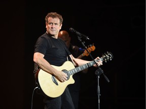 (FILES) In this file photo taken on June 16, 2014, South African singer Johnny Clegg performs during the 20th edition of the World Sacred Music Festival in Fez, Morocco. - South African singer Johhny Clegg has died at the age of 66, his manager said, on July 16, 2019.