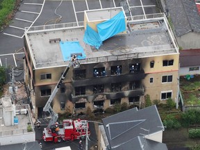 This aerial view shows the rescue and recover scene after a fire at an animation company building killed some two dozen people in Kyoto on July 18, 2019. - At least 24 people were feared dead in a suspected arson attack on the animation company in the Japanese city of Kyoto on July 18, a fire department official told AFP.