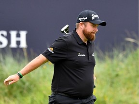 Ireland's Shane Lowry smiles as he finishes at the 18th green during the second round of the British Open golf Championships at Royal Portrush golf club in Northern Ireland on July 19, 2019.