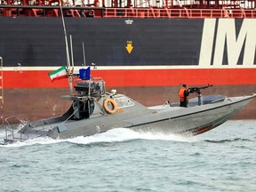An image grab taken from a broadcast by Islamic Republic of Iran Broadcasting (IRIB) on July 22, 2019 shows Iranian Revolutionary Guards in speedboats patrolling a tanker Stena Impero as it's anchored off the Iranian port city of Bandar Abbas.