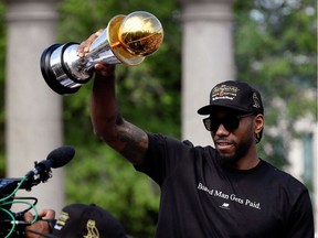 Toronto Raptors basketball player Kawhi Leonard hold his MVP trophy during the Raptors victory parade after defeating the Golden State Warriors in the 2019 NBA Finals, in Toronto, Ontario, Canada June 17, 2019.