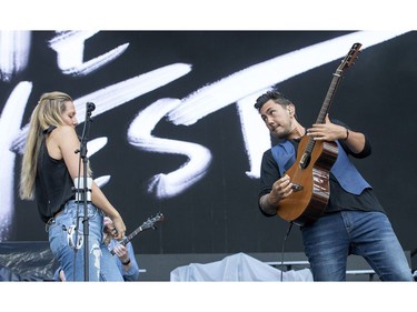 Gone West members Colbie Caillat and Justin Young performing on the city stage following a severe thunderstorm that blew through Ottawa on day 7 of RBC Bluesfest. Photo by Wayne Cuddington/ Postmedia