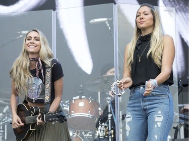 Gone West members (from left) Nelly Joy and Colbie Caillat performing on the city stage following a severe thunderstorm that blew through Ottawa on day 7 of RBC Bluesfest. Photo by Wayne Cuddington/ Postmedia