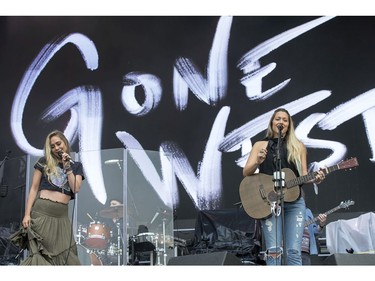 Gone West members Nelly Joy (L) and Colbie Caillat performing on the city stage following a severe thunderstorm that blew through Ottawa on day 7 of RBC Bluesfest. Photo by Wayne Cuddington/ Postmedia
