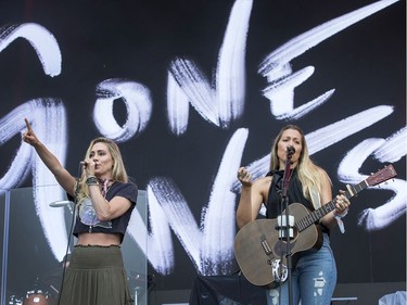 Gone West members Nelly Joy (L) and Colbie Caillat performing on the city stage following a severe thunderstorm that blew through Ottawa on day 7 of RBC Bluesfest. Photo by Wayne Cuddington/ Postmedia