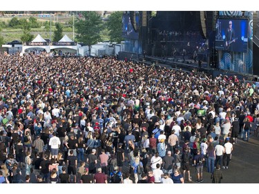A massive crowd is on hand to watch The Offspring on the city stage as day 8 of RBC Bluesfest takes place on the grounds on the Canadian War Museum in Ottawa. Photo by Wayne Cuddington/ Postmedia