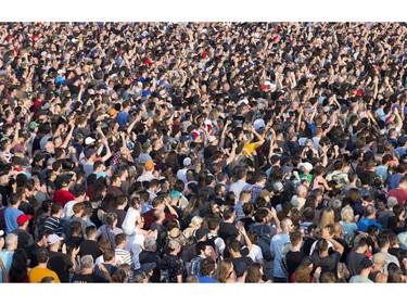 A massive crowd is on hand to watch The Offspring on the city stage as day 8 of RBC Bluesfest takes place on the grounds on the Canadian War Museum in Ottawa. Photo by Wayne Cuddington/ Postmedia