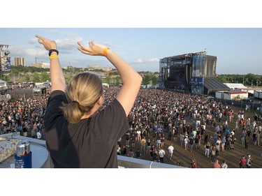A massive crowd is on hand to watch The Offspring on the city stage as day 8 of RBC Bluesfest takes place on the grounds on the Canadian War Museum in Ottawa. Photo by Wayne Cuddington/ Postmedia