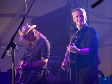 Cooper McBean, (from left) and Pete Bernhard of The Devil Makes Three on the Bluesville stage on day 6 of RBC Bluesfest. Photo by Wayne Cuddington/ Postmedia