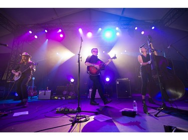 Cooper McBean, (from left) Pete Bernhard and Lucia Turino of The Devil Makes Three on the Bluesville stage on day 6 of RBC Bluesfest. Photo by Wayne Cuddington/ Postmedia