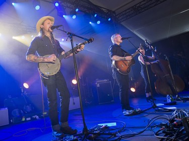 Cooper McBean, (from left) Pete Bernhard and Lucia Turino of The Devil Makes Three on the Bluesville stage on day 6 of RBC Bluesfest. Photo by Wayne Cuddington/ Postmedia