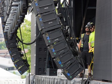 Workers prepare the City Stage on Wednesday, July 3, 2019 as the 25th anniversary edition of Bluesfest gets ready to open on Thursday evening.