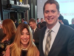 Chani Aryeh-Bain with Andrew Scheer. The Conservative candidate for a seat in Toronto is seeking to have the federal voting day moved because it falls on a Jewish holiday.