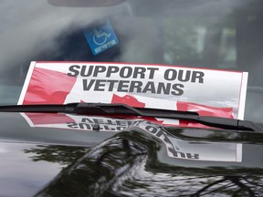 A sign is placed on a truck windshield outside the Veterans Affairs office in Halifax on Thursday, June 16, 2016. A Montreal project to help homeless veterans find a place to live and other necessary services is among 22 initiatives receiving federal money from a fund that supports former military members.