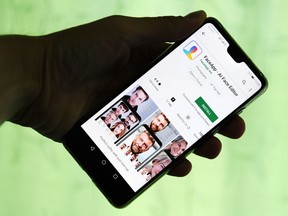 This illustration picture shows FaceApp application displayed on the screen of a smartphone. - The chart-topping Russian-made application FaceApp, which allows millions of users to see how they will look as they age, finds itself in the eye of a political storm in the United States, with one senator urging an FBI investigation into its "national security and privacy risks".